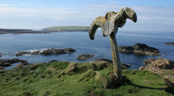 Photo View of Birsay, Orkney with a whale bone in the foreground.