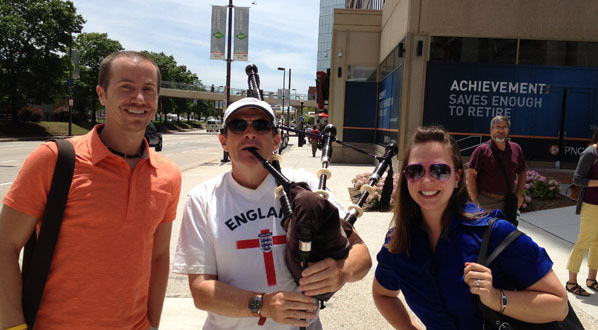 Photo LOC member Nate Spillman with Olivia Puglisi (Visit Baltimore) and a street musician