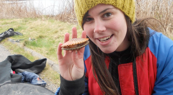 Photo University student holds her catch following a scallop diving trip in Oban.