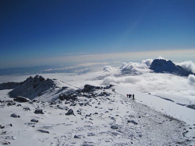 Photo Mt. Kilimanjaro, with its snow-capped peak, attracts climbers from around the world.